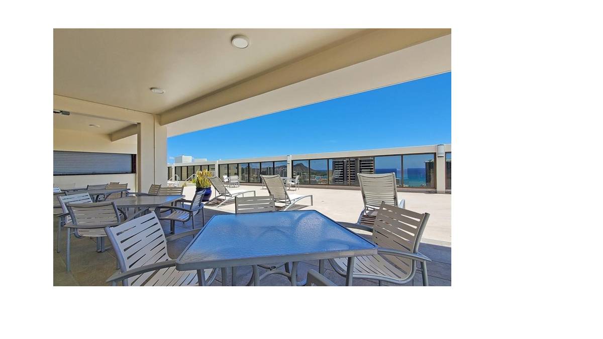 A table and chairs are set up on a patio.